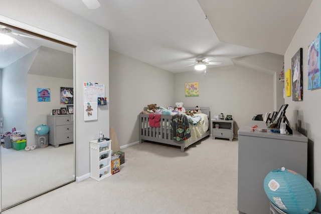 carpeted bedroom featuring ceiling fan and lofted ceiling