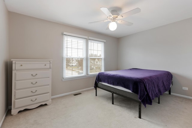 bedroom with ceiling fan and light colored carpet