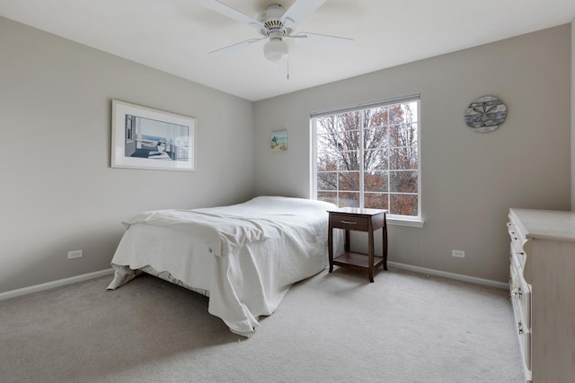 bedroom featuring ceiling fan and light colored carpet