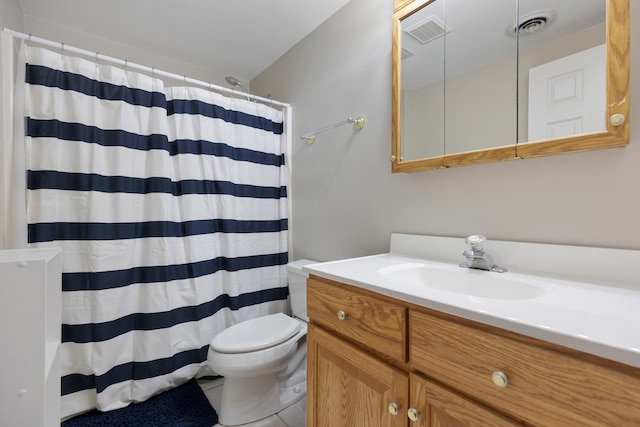 bathroom featuring tile patterned flooring, vanity, curtained shower, and toilet