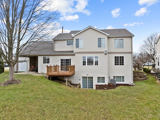 rear view of house with central AC, a yard, and a deck