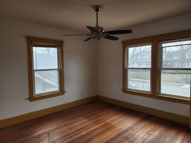 unfurnished room with ceiling fan and wood-type flooring