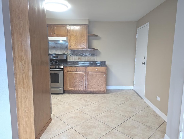 full bathroom featuring tile patterned flooring, vanity, toilet, and tiled shower / bath combo