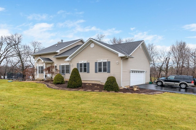 view of side of home with a garage and a yard