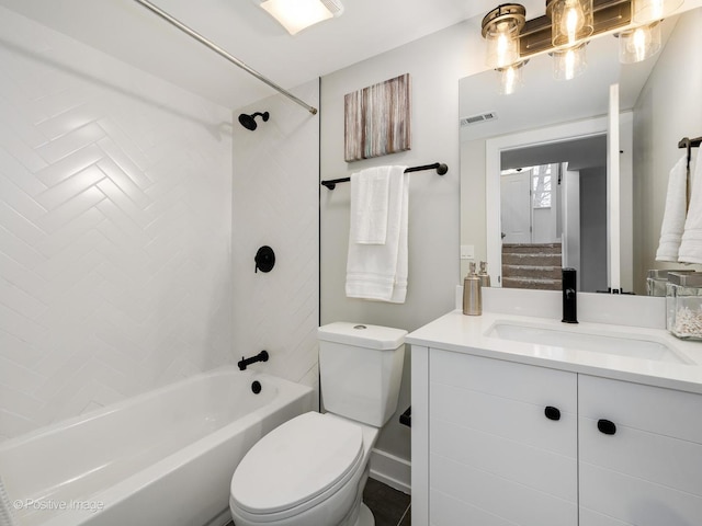 full bathroom featuring vanity, toilet, and tiled shower / bath combo