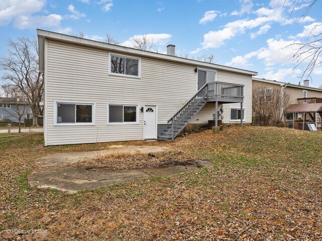 rear view of house featuring a deck