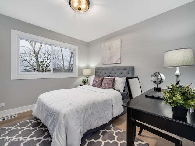 bedroom featuring dark wood-type flooring