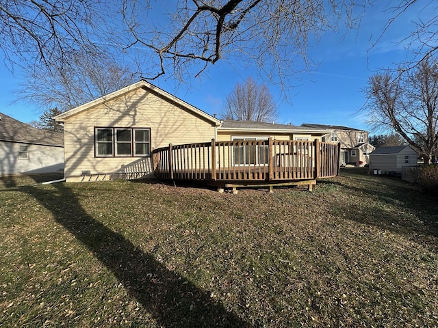 back of house with a yard and a deck