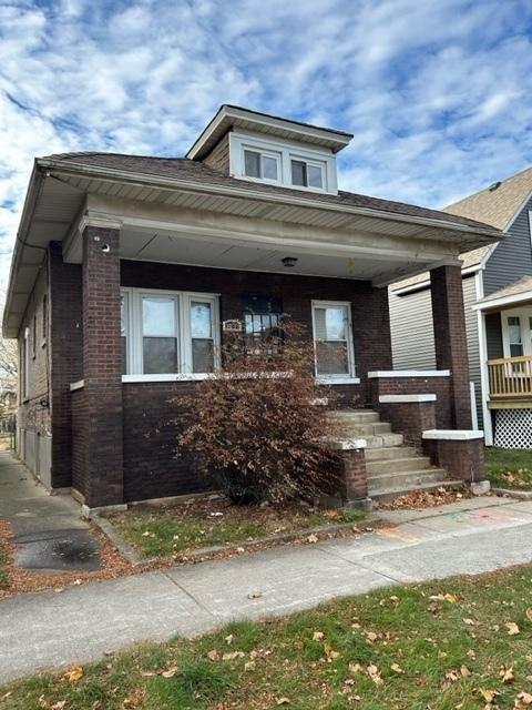 bungalow-style home with a porch