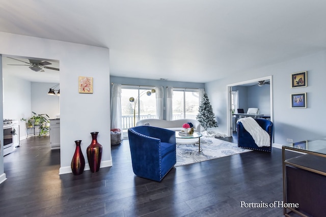 living room featuring dark hardwood / wood-style floors and ceiling fan