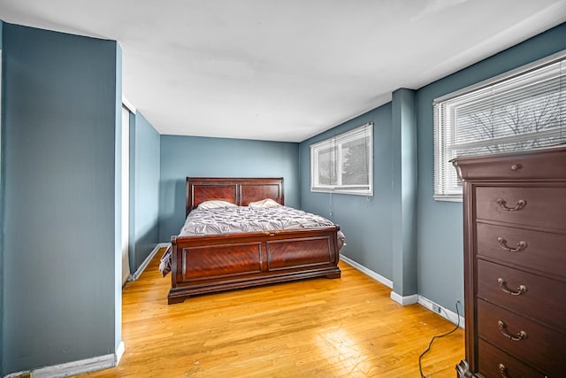 bedroom with light hardwood / wood-style floors