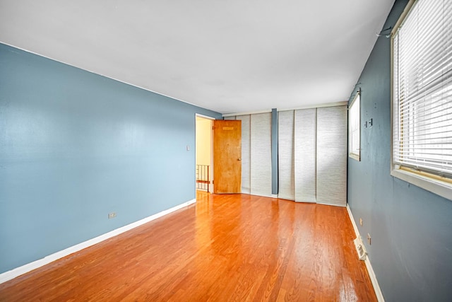 unfurnished bedroom featuring hardwood / wood-style floors