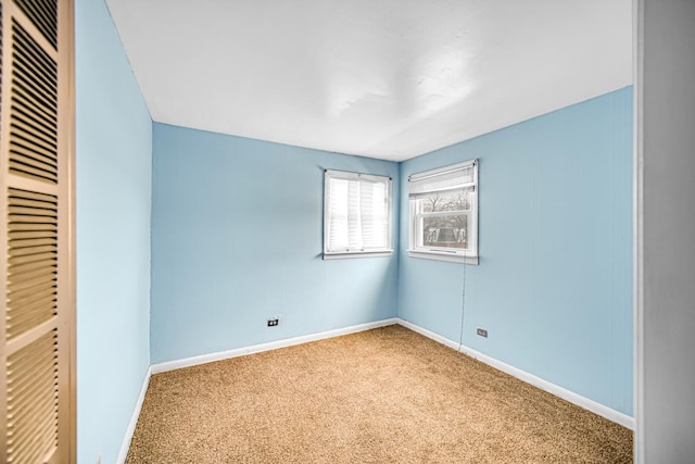 unfurnished bedroom with carpet flooring and a closet