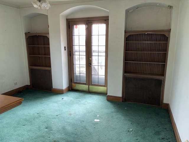 empty room featuring carpet and french doors