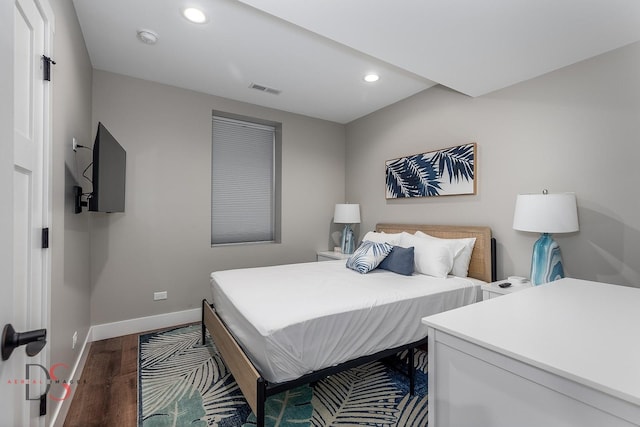 bedroom featuring dark hardwood / wood-style flooring