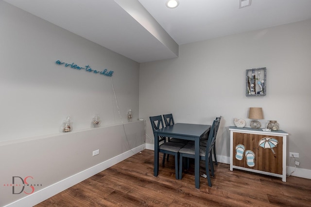 dining area with dark hardwood / wood-style floors