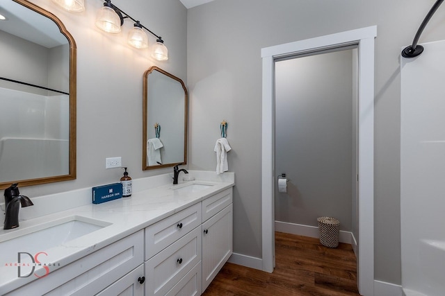 bathroom featuring hardwood / wood-style flooring and vanity