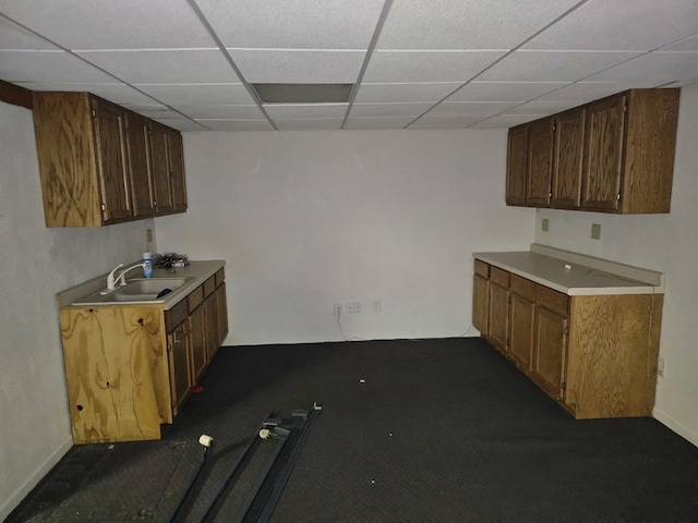 kitchen with sink and a drop ceiling