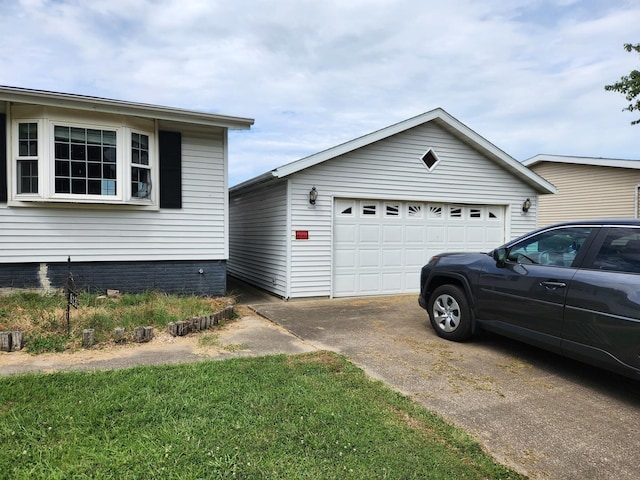 view of side of home with a garage