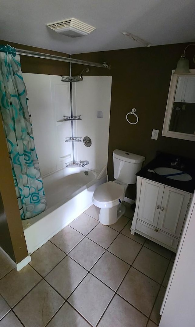 full bathroom featuring tile patterned flooring, vanity, toilet, and shower / tub combo with curtain