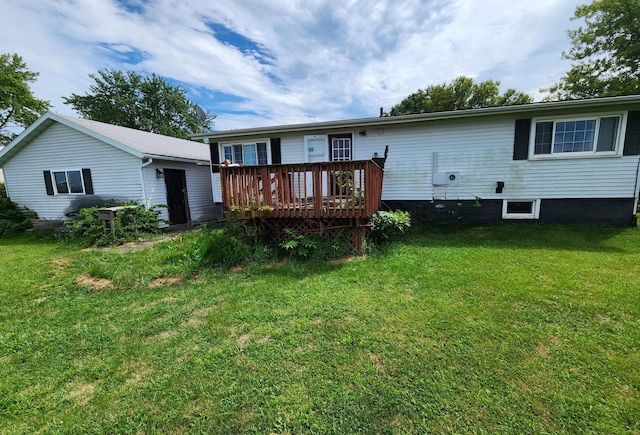 back of house with a lawn and a wooden deck