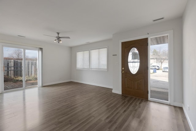 entryway with ceiling fan and dark wood-type flooring