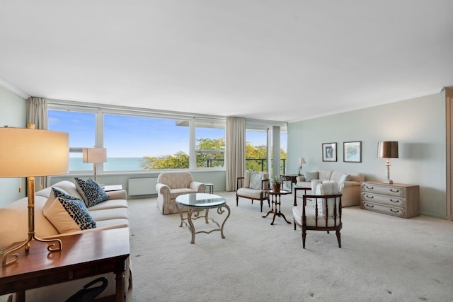 living room featuring light carpet, ornamental molding, and a water view