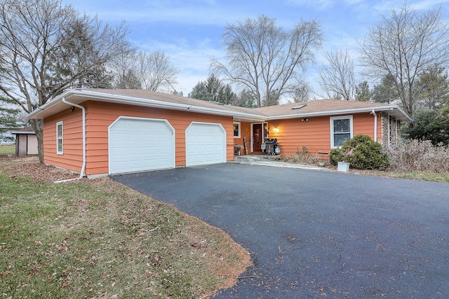 single story home featuring a garage