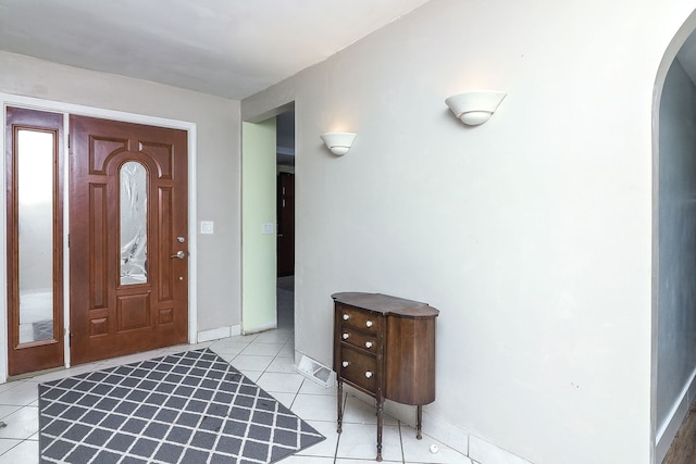 foyer entrance with light tile patterned floors