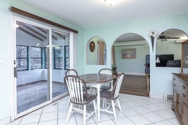 tiled dining area featuring ceiling fan