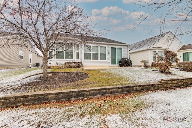 rear view of house with central AC