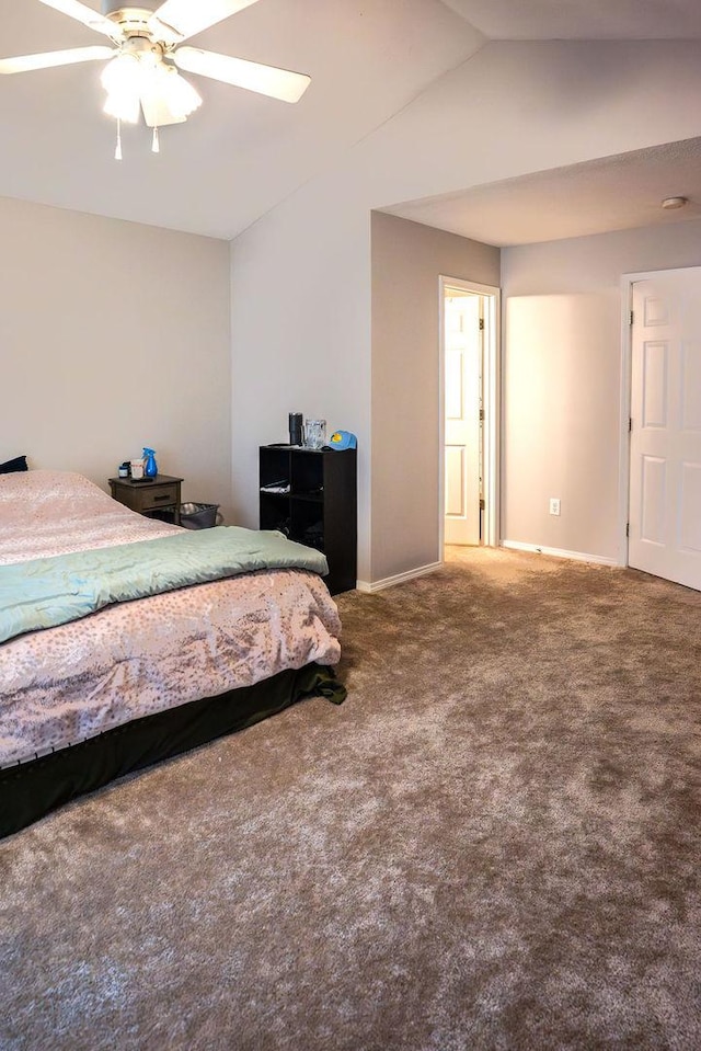 carpeted bedroom featuring ceiling fan and lofted ceiling