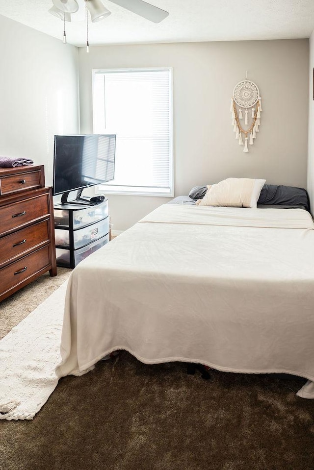 carpeted bedroom featuring ceiling fan