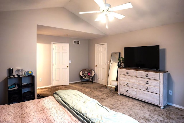 carpeted bedroom featuring ceiling fan and vaulted ceiling