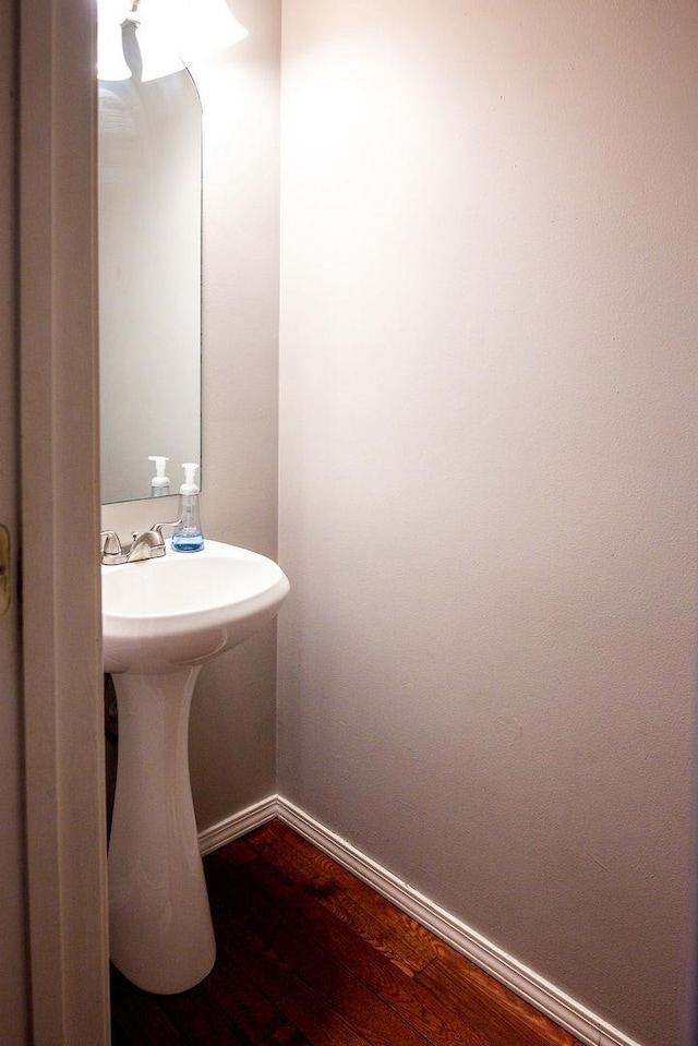 bathroom with wood-type flooring