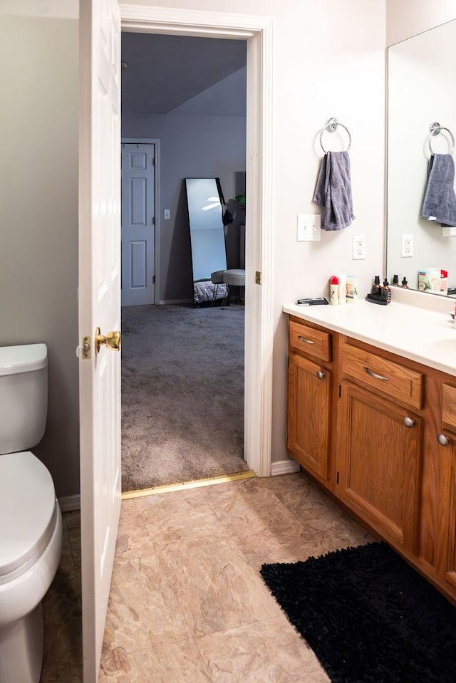 bathroom with vanity and toilet