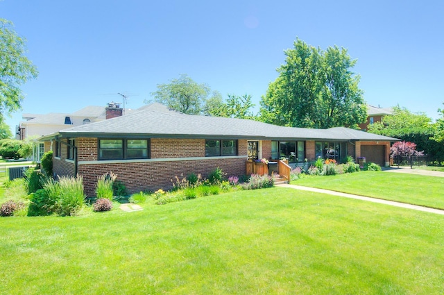 single story home with a front yard, a porch, and a garage