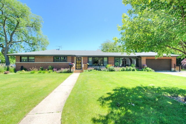 ranch-style home with a front yard and a garage