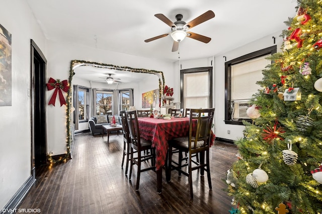 dining area with ceiling fan, cooling unit, and dark hardwood / wood-style floors