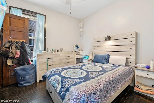 bedroom with ceiling fan and dark hardwood / wood-style floors