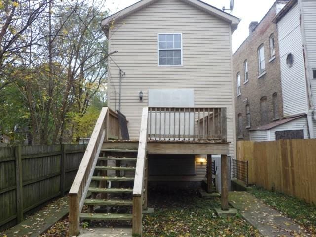 back of house featuring a deck