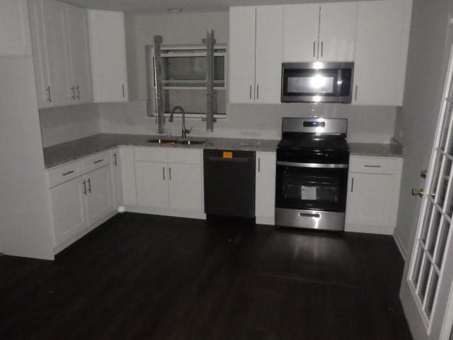 kitchen with sink, white cabinets, and stainless steel appliances