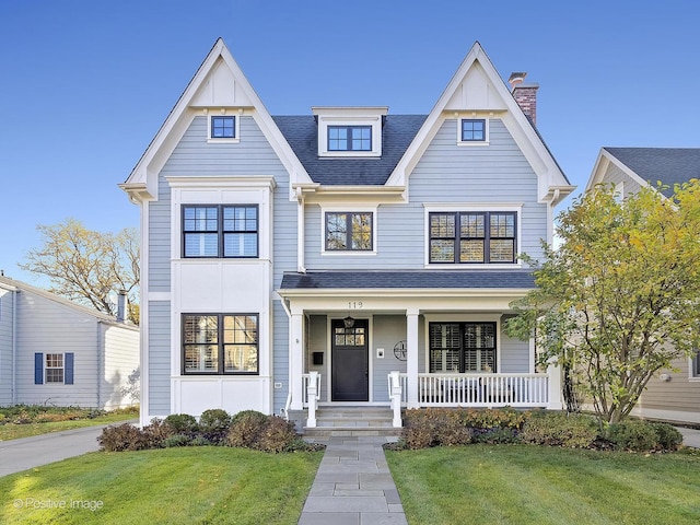 view of front of home featuring a porch and a front yard