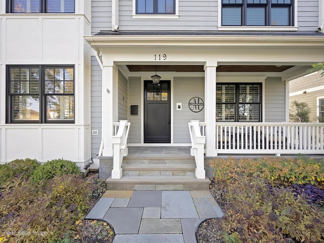 doorway to property featuring covered porch