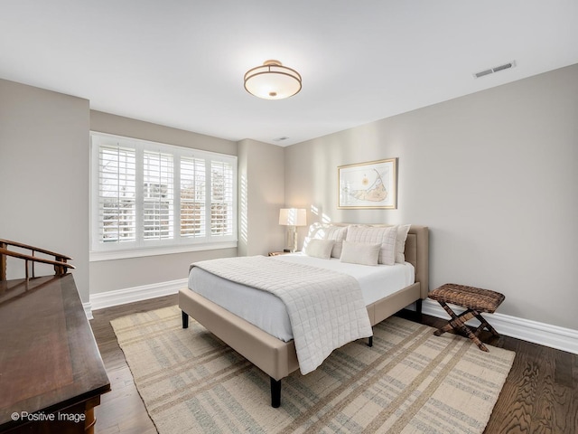 bedroom with hardwood / wood-style floors