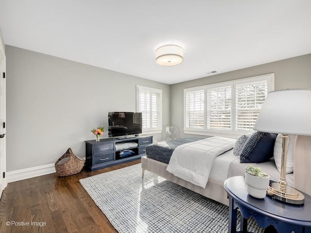 bedroom featuring dark wood-type flooring