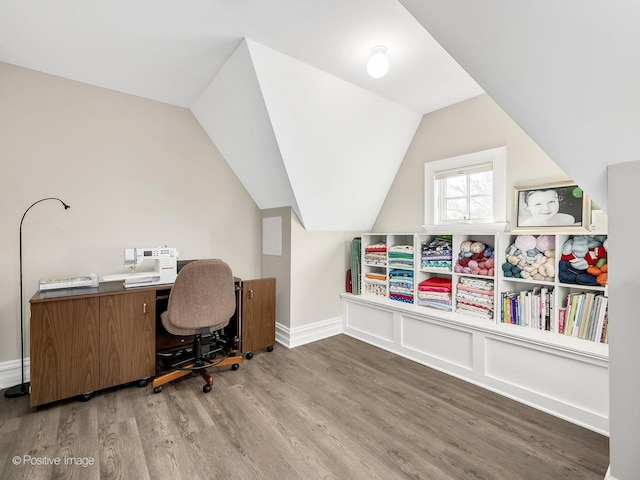 office featuring vaulted ceiling and light wood-type flooring