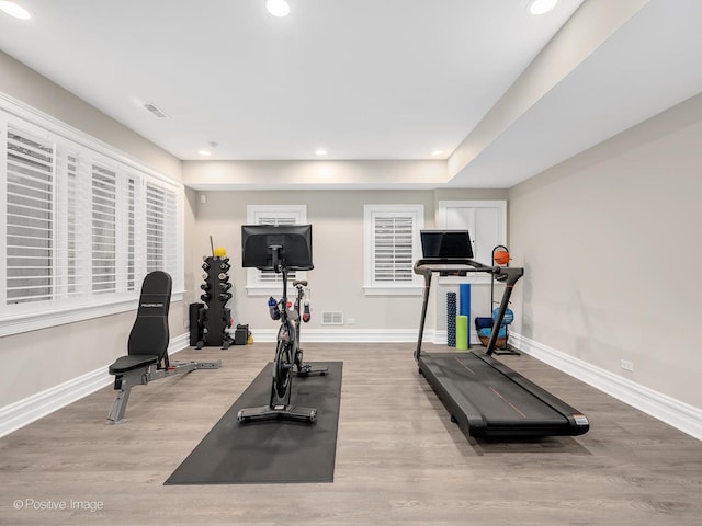 workout area featuring light wood-type flooring