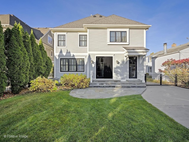 front of property featuring a patio area and a front yard