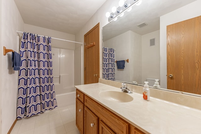 full bathroom with toilet, vanity, visible vents, and tile patterned floors